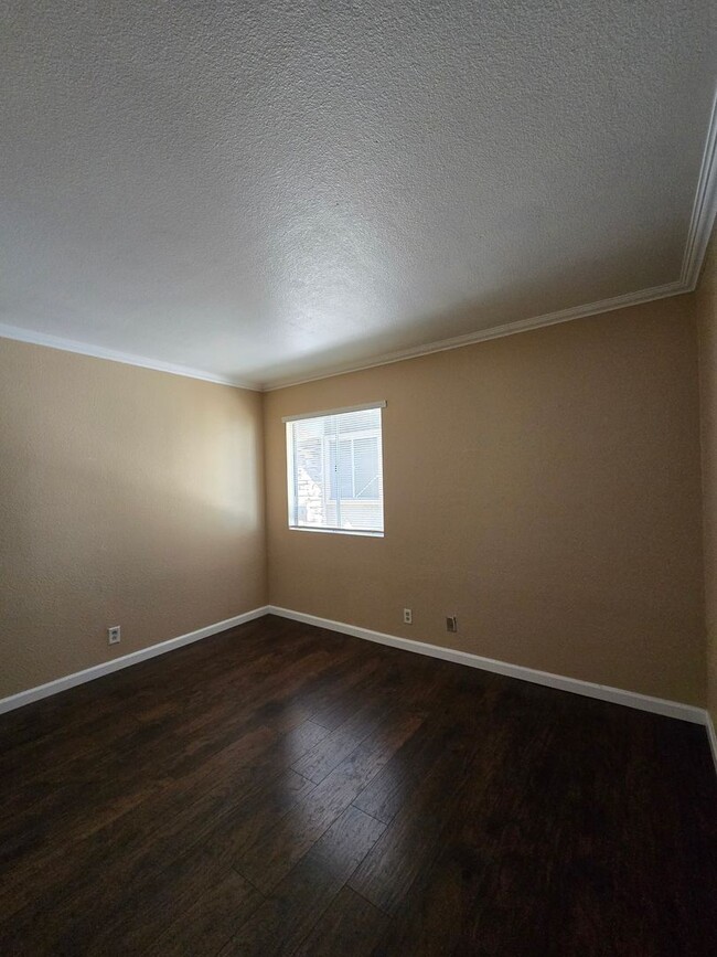 Building Photo - Beautiful 2-Bedroom First-Floor Condo in a Guard-Gated Community