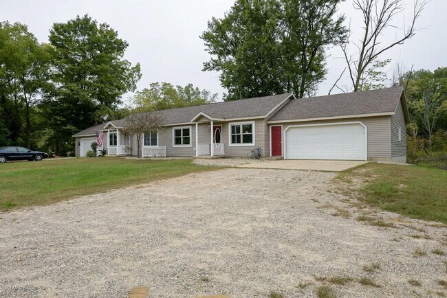 Building Photo - Spacious 3BR Duplex with Finished Basement & 2-Car Garage in Otsego