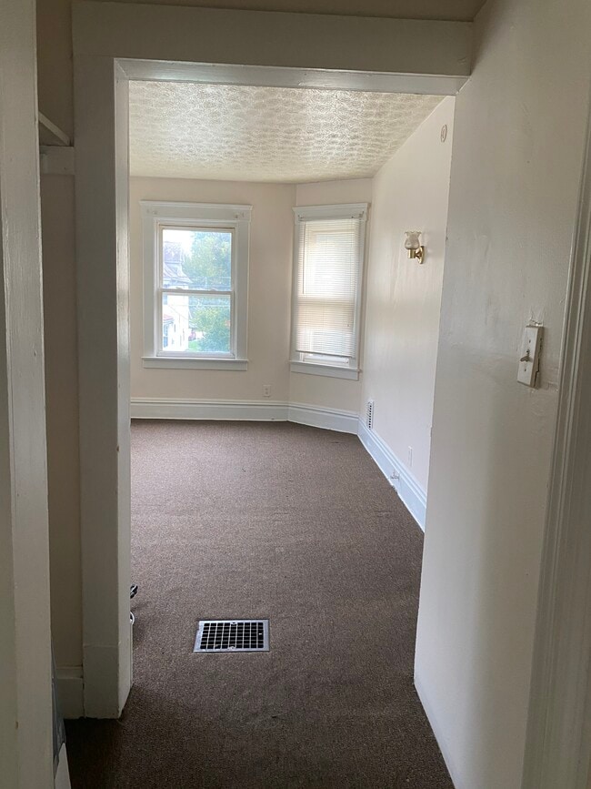 suite#2 living room (carpet removed and floors being updated) - 249 8th St