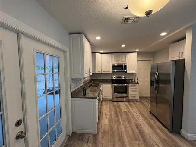 Building Photo - 5825 Lullaby Ln