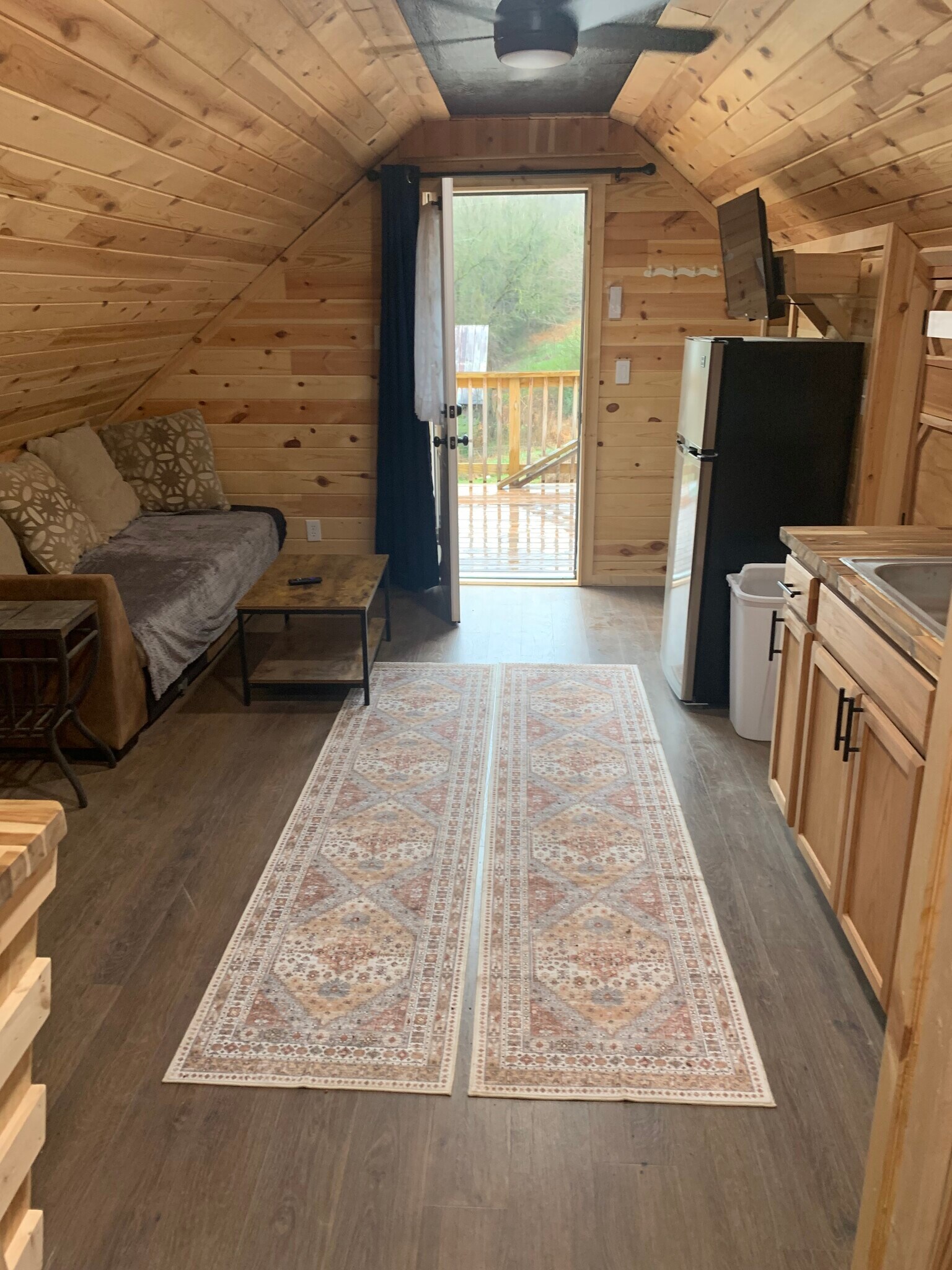 View from inside living area towards the front door and deck - 135 Lock Seven Ln