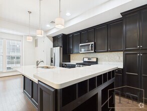 Building Photo - 2-bedroom 2.5 bath Luxury Townhome located...