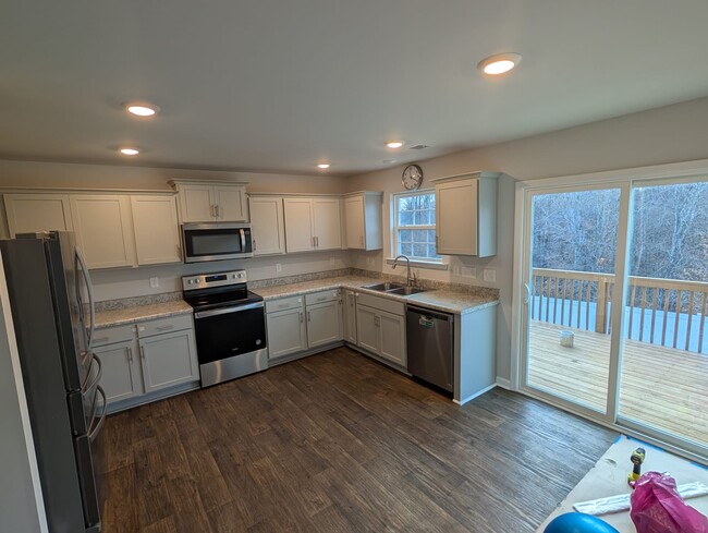 Kitchen with balcony. - 1682 Weatherend Dr