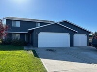Building Photo - August Rent FREE - 4 Bedroom / Triple Car Garage