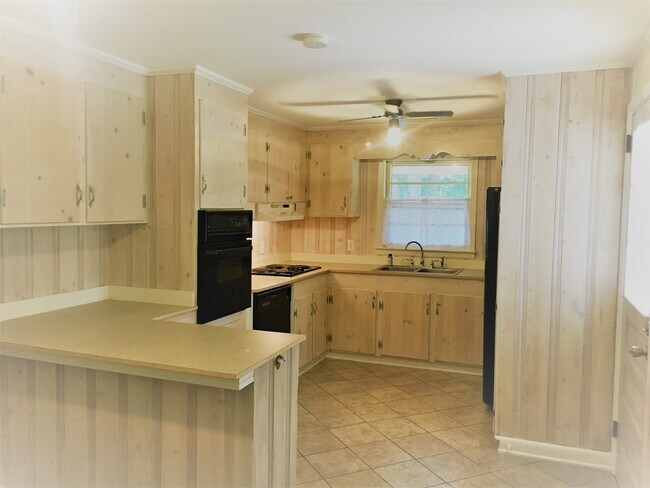 Building Photo - Cottage style brick ranch home, carport, f...