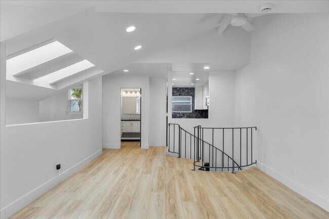 Building Photo - COMPLETELY REMODELED, BRIGHT & AIRY, TRI-LEVEL HOME W/ TOP-FLOOR GREAT ROOM LIVING SPACE, 2-CAR G...