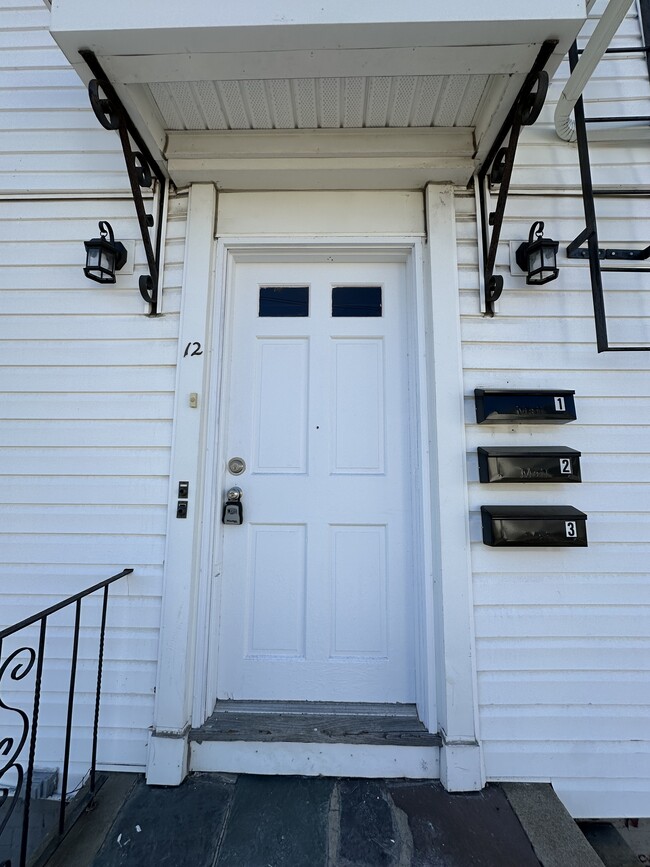 Main Entrance with labeled mailboxes for each floor - 12 Tiffany St