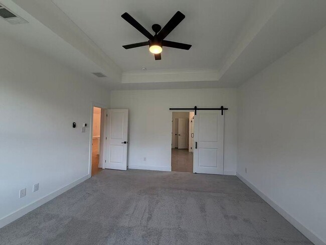 Building Photo - Move-in ready and like-new! Washer, dryer, and refrigerator Included.