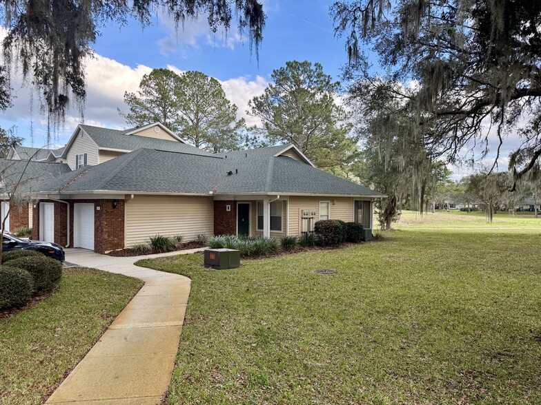 Maintained green space with classic Florida Live Oaks - 13200 W Newberry Rd