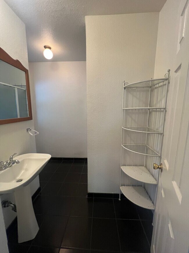 Building Photo - Charming 3-Bedroom, 2-Bath Tri-Level Home with Unfinished Basement
