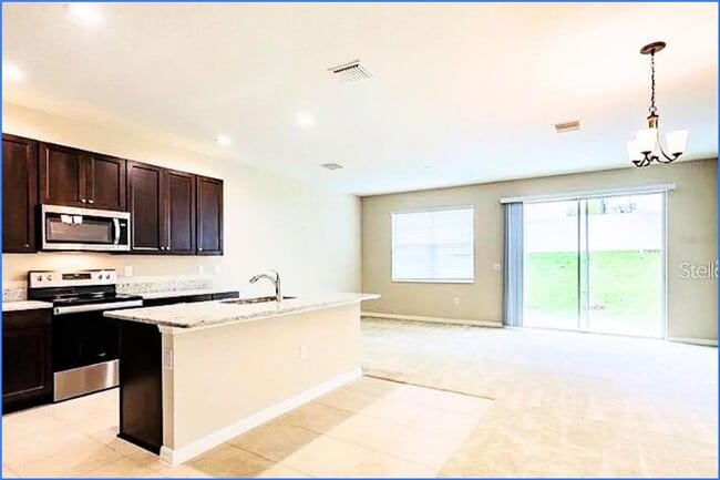 Building Photo - 6320 Tillandsia Pl