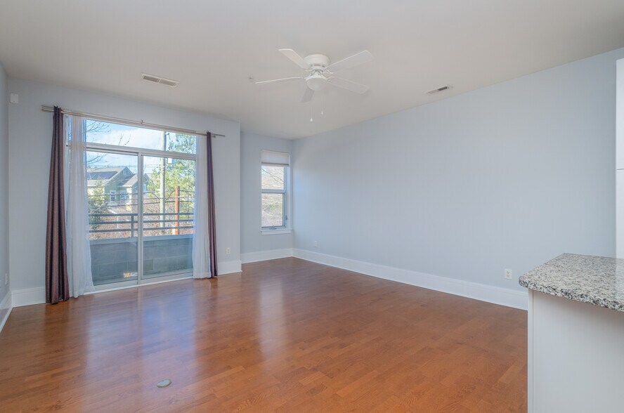 From the dining area looking at the living room and balcony - 1600 Fulton Ave
