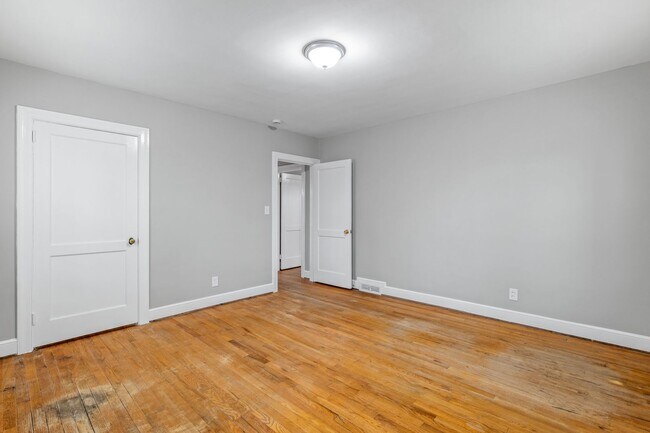 Building Photo - Brick home, Two Story, Hardwoods, DR, 2 Sun Rooms, FP, Carport!.