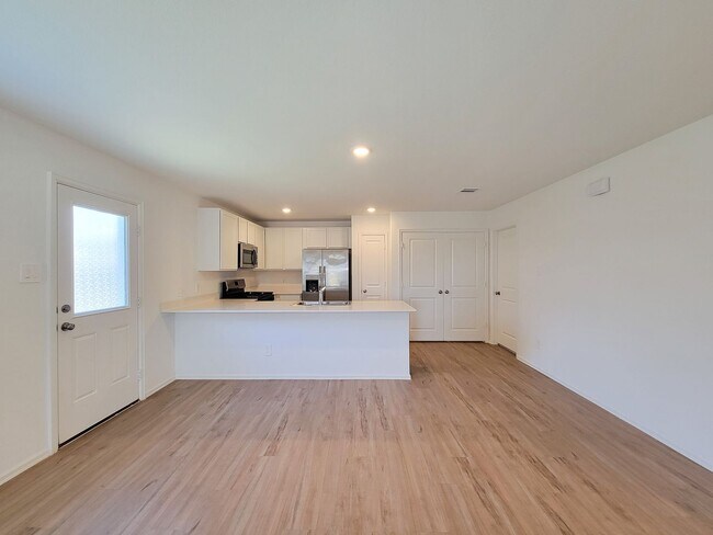 Building Photo - This single-story home has a comfortable layout with three bedrooms and a living area all on one ...