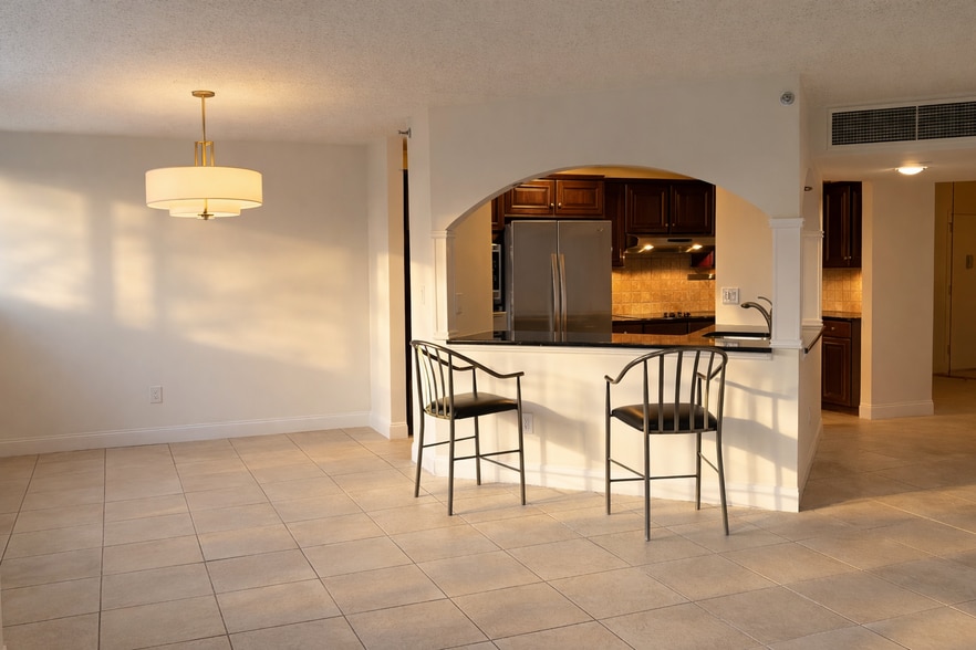 Open pass-through connecting dining area and kitchen. - 25 Rockledge Ave