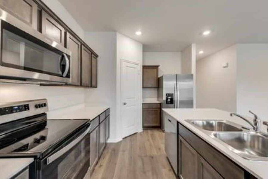 Kitchen with large Pantry and stainless steel appliances - 1131 Elijah Way
