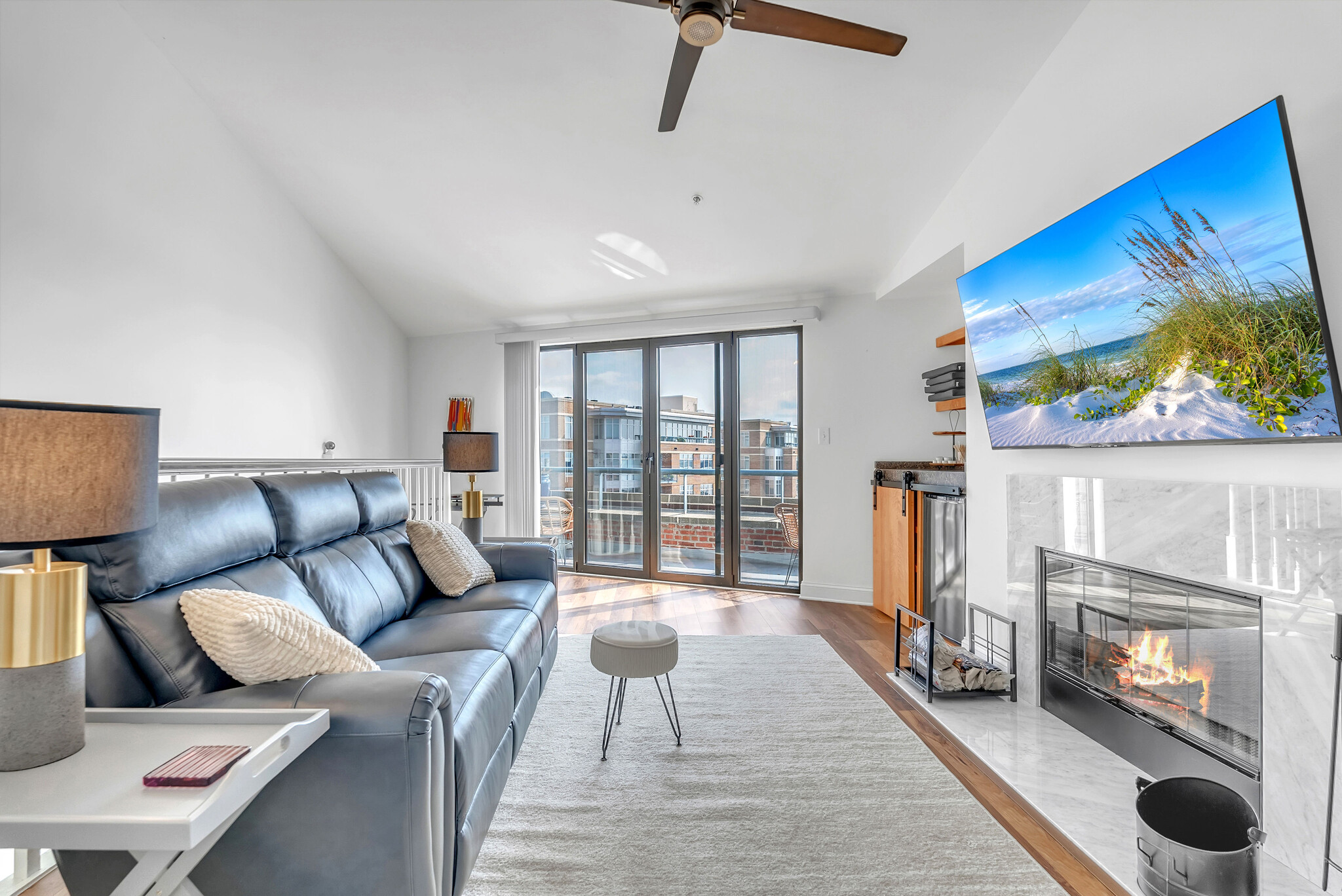Upstairs living room with Italian leather 3-seat recliner, wood burning fireplace, mini-fridge. - 1000 Fell St