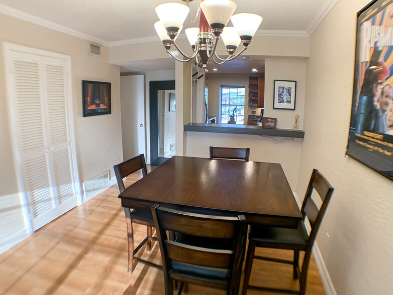 The dining area connects to the kitchen with open bar. Great for hosting. - 2425 Ashdale Dr