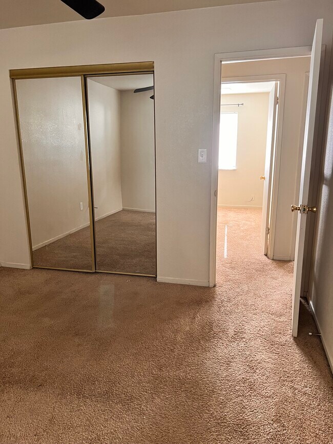 Primary Bedroom w/mirrored closet doors - 5026 Dana Ave