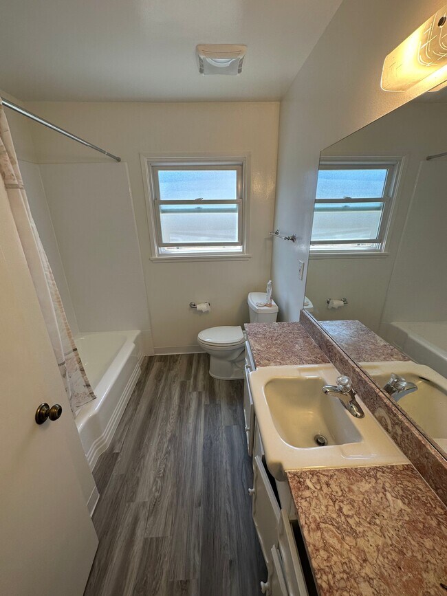 Bathroom with tub and shower - 20724 Christine Ave