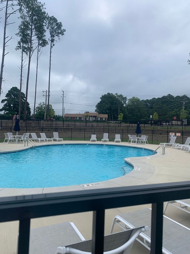 Building Photo - BRAND NEW TOWNHOME! 2 CAR GARAGE. SCREENED IN PORCH. MODERN KITCHEN. OPEN CONCEPT LIVING. BONUS ROOM