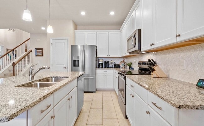 Building Photo - Water Front Home- 4 Large Bedrooms-3 baths Gated Community Call Sheila Campbell 407-687-7900