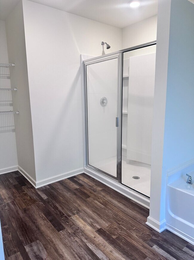Building Photo - efficient two-level home provides a large living room, 4 very spacious bedrooms, and 2.5 bathrooms