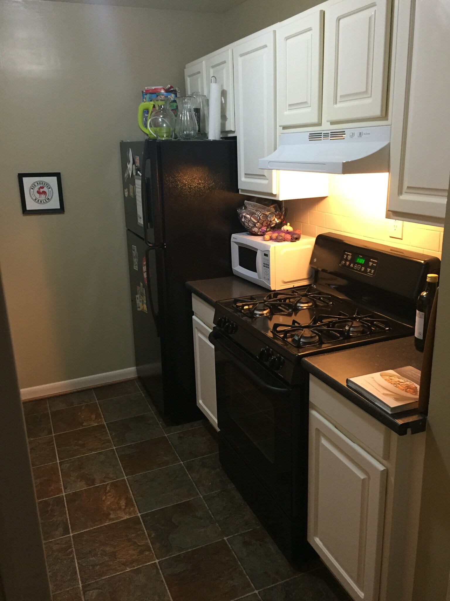 Kitchen with gas range/oven, full fridge/freezer, microwave, sink with garbage disposal. - 2030 F St NW