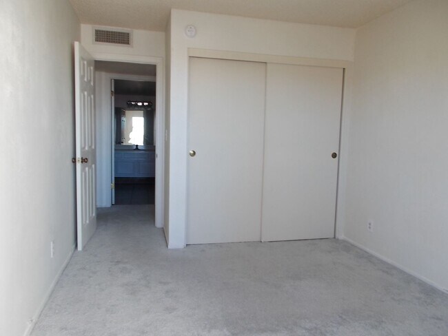 Building Photo - Two-story, 2-bedroom townhome ideally located in the heart of Boulder City
