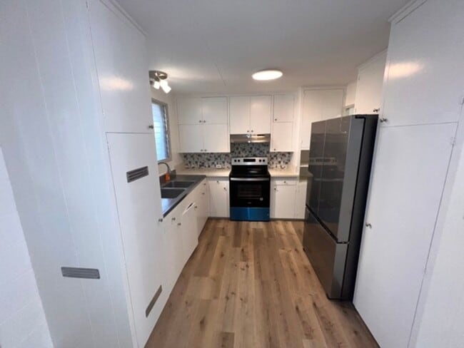 Building Photo - 5 Bedrooms | 2 Bathrooms | 3-Car Carport |...