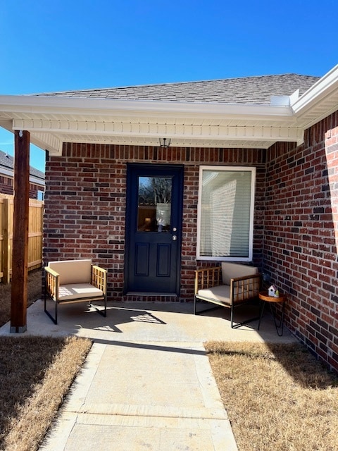 Covered back porch overlooks small privacy fenced backyard. - 2488 N Raven Ln