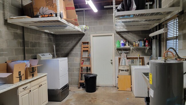 Garage from the garage door. Heavy duty storage racks. Washer and dryer - 4359 4th Ave. S.