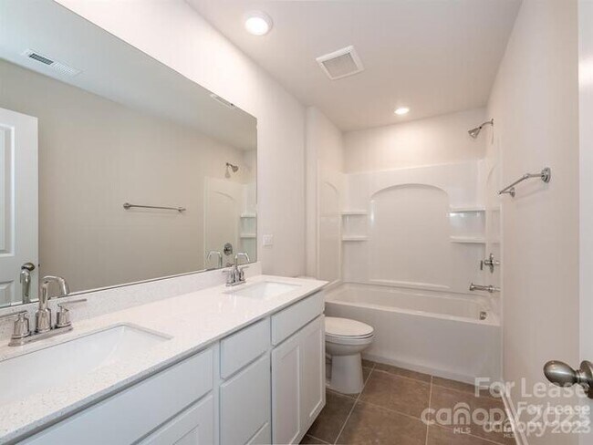 Building Photo - Charming 3-Bedroom Home with Landscaped Ba...