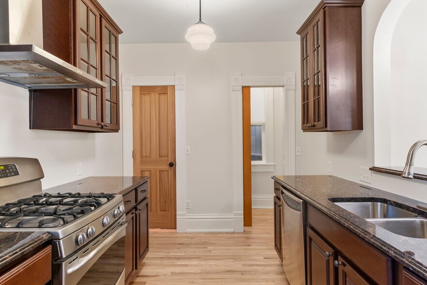 Kitchen also provides access to walk in pantry and clean basement storage area. - 3347 Tejon St