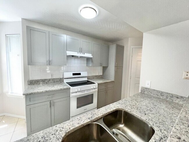 Building Photo - NEW-Remodeled bathroom & kitchen! NEW VINYL PLANK flooring & fresh paint! 2 bedroom 1 bath condo ...