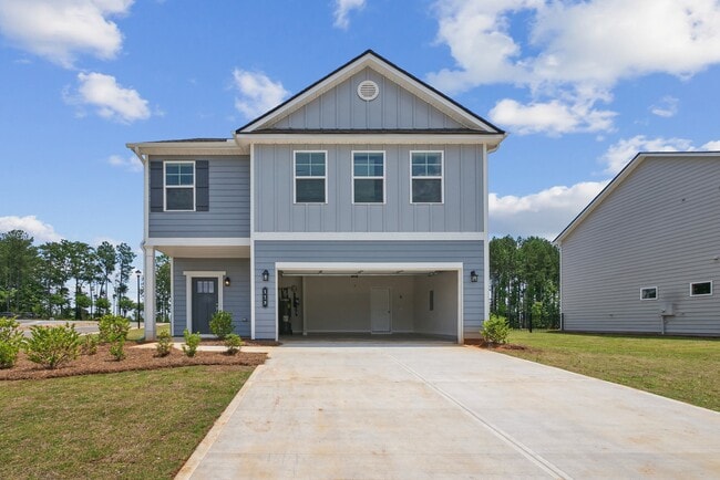 Exterior of the Rosewood, two story home with a private driveway and attached garage. - Alma Farms