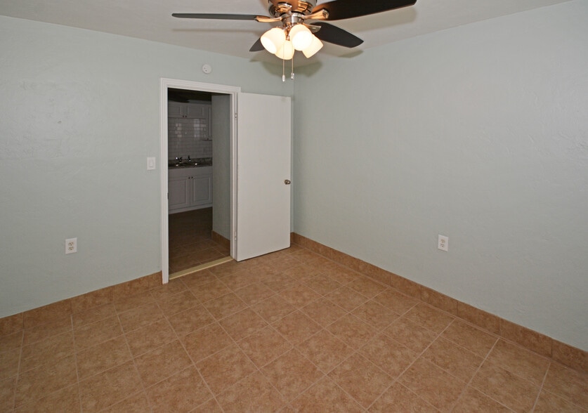 Bedroom 1 (kitchen through doorway) - 5009 TANGERINE AVE S
