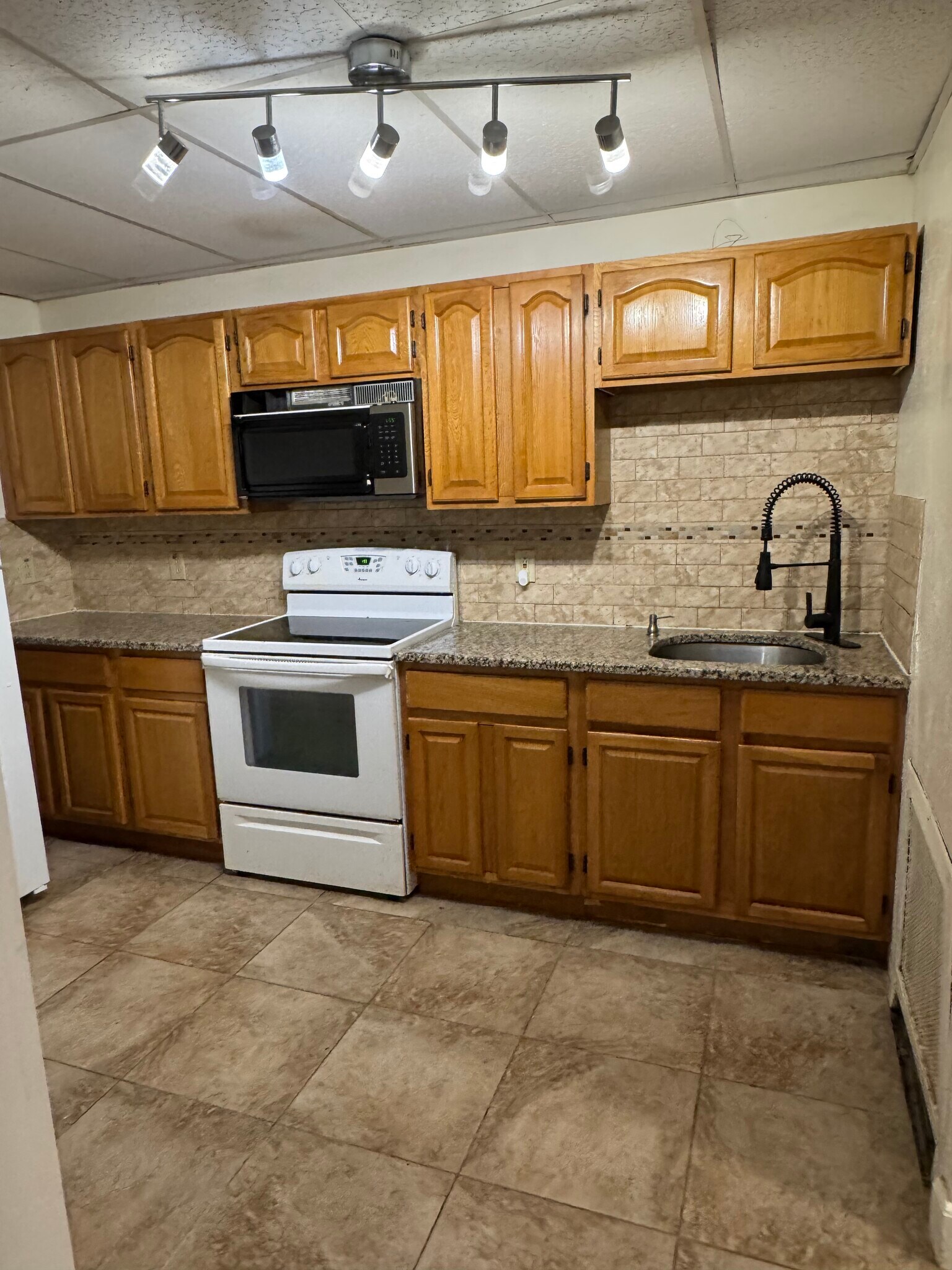 Kitchen with Microwave & Refrigerator - 151 N Hanover St