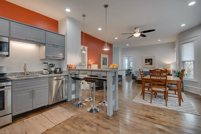 The great room combines the kitchen, dining and living areas. - 3020 Columbus Ave