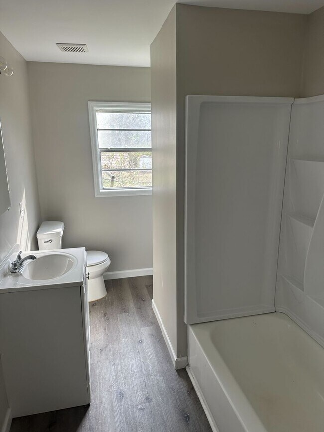 Building Photo - Spacious 3BR/2BA with Cozy Fireplace & Bright Living