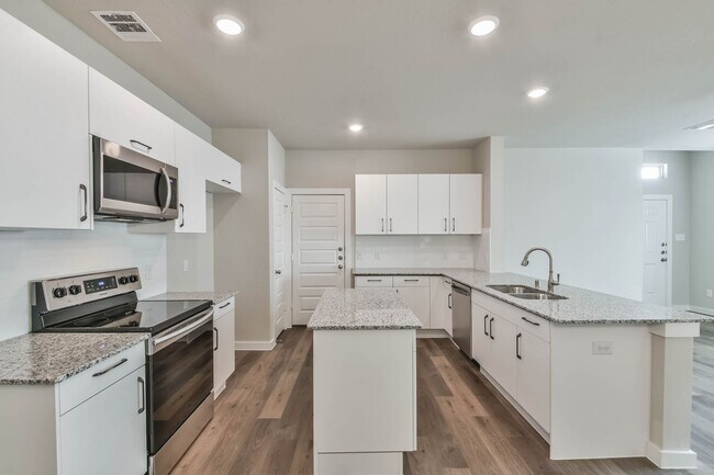 Building Photo - High Ceilings, Low Maintenance -Say Hello ...