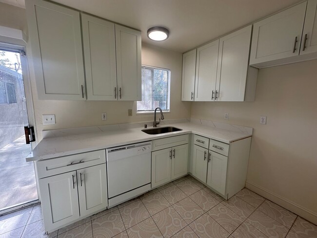 Building Photo - Recently Updated 4 Bedroom Home with Yard
