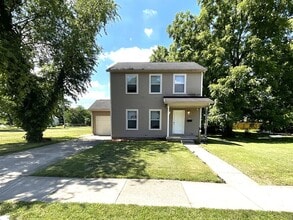 Building Photo - For Rent - 4 Bedroom, 2 Full Bath Home with Ground-Floor Bedroom, Attached Garage and Brand-New K...