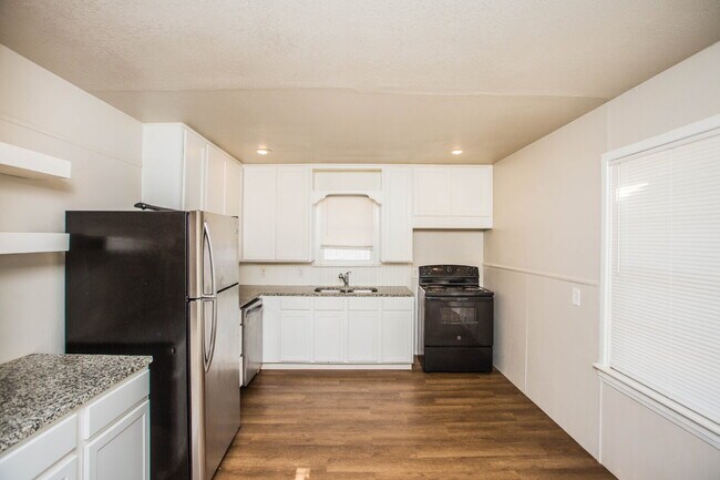Building Photo - "Charming 4-Bedroom Home with Granite Touches & Gleaming Hardwood Floors in Lubbock!"