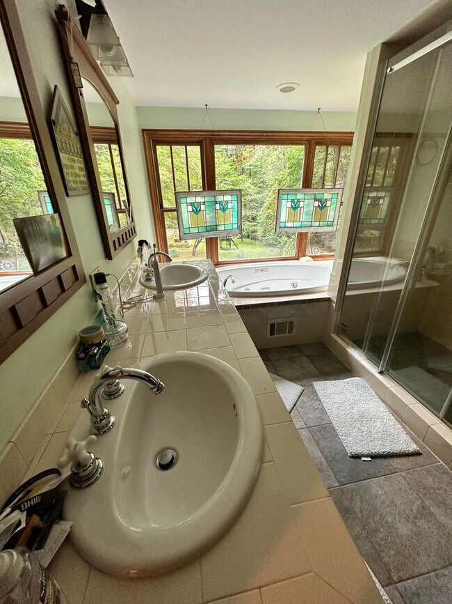 Building Photo - Dream Home in Highland, Michigan: Your Private Oasis on 5 Wooded Acres