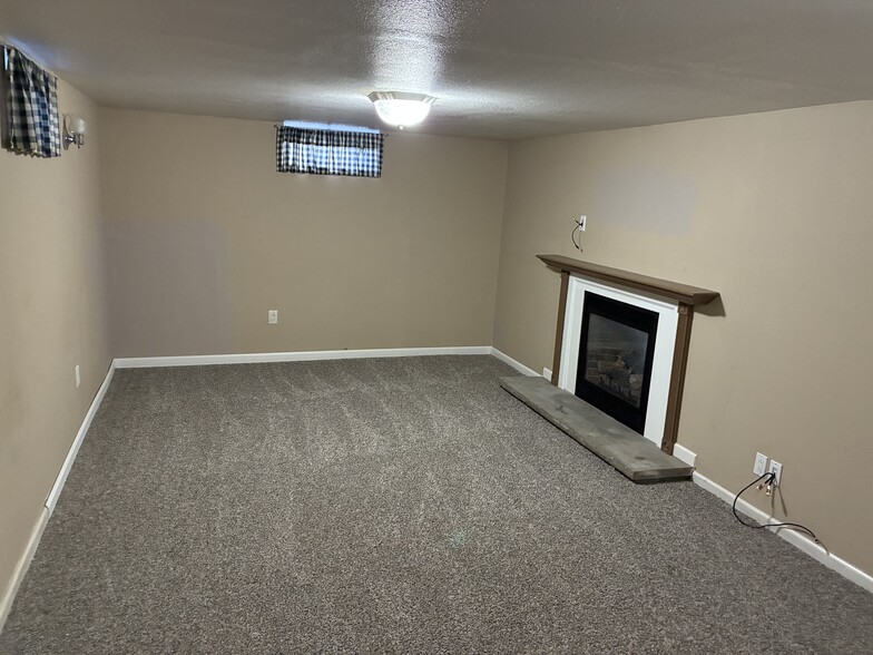 Basement rec area with gas fireplace - 28 Ramblewood Dr