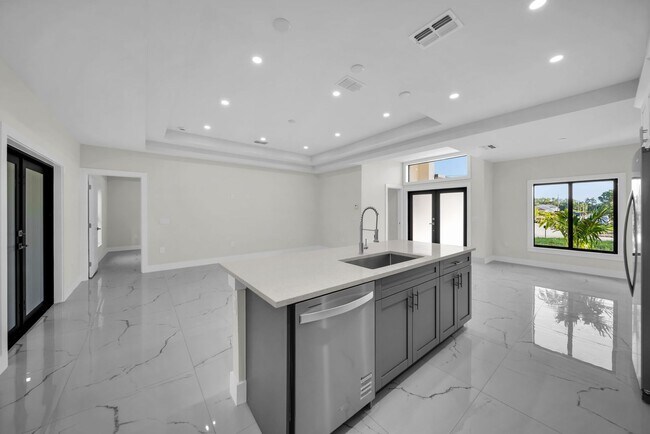 Building Photo - Brand-New Home in Lehigh Acres – Move-In Ready! FL 33974. Qualify for a deposit-free option and s...