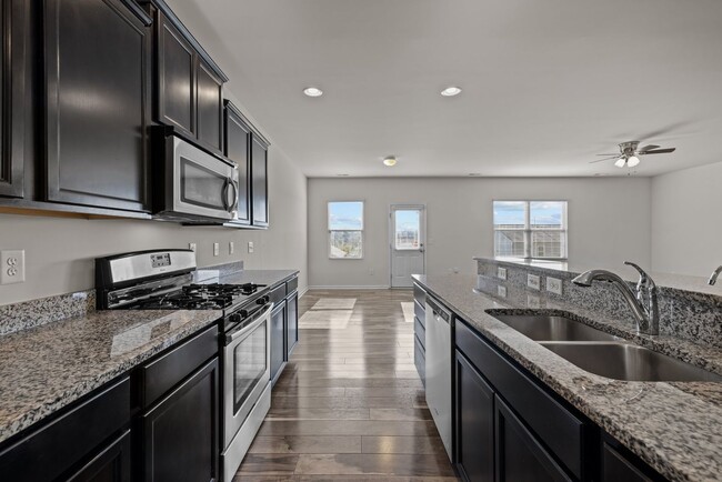 Building Photo - Spacious 5 Bedroom Home with 2-Car Garage,...