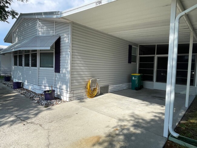 Building Photo - 2 BR 2 BATH Annual Rental in Barefoot Bay Available JUNE 2025