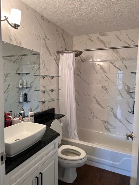 Newly redone bathroom with brand new tiling, toilet, granite, and vanity sink - 440 N Wabash Ave